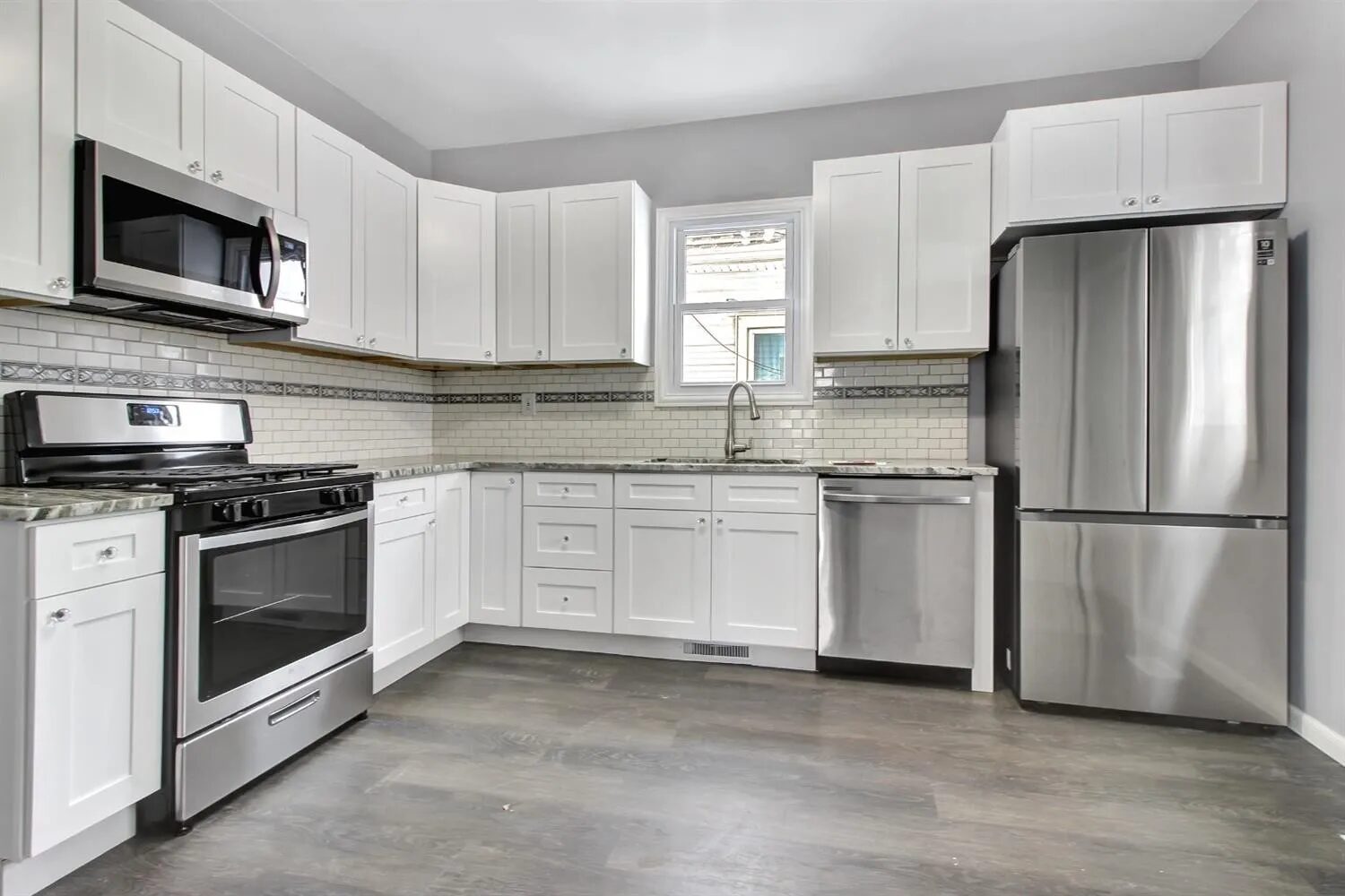 Remodeled kitchen with white shaker cabinets in Hammond, Indiana