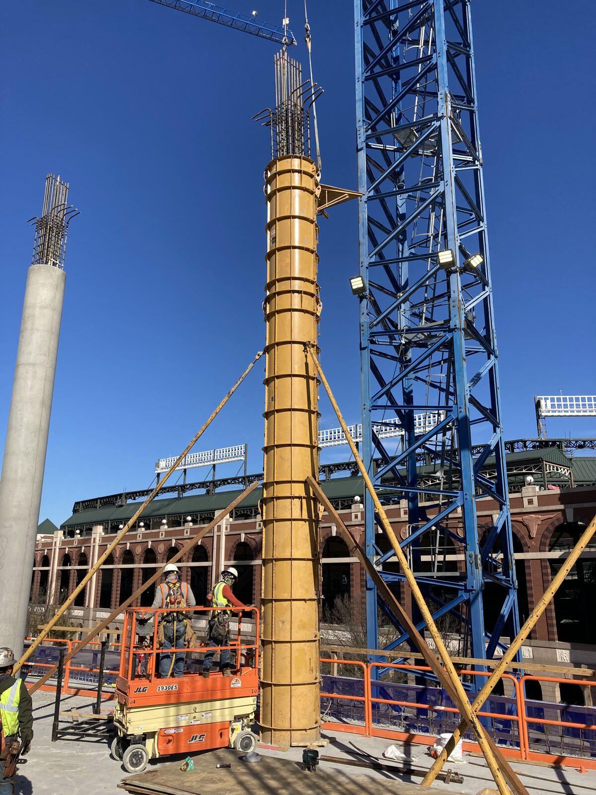 Tower crane lifting materials on a commercial jobsite
